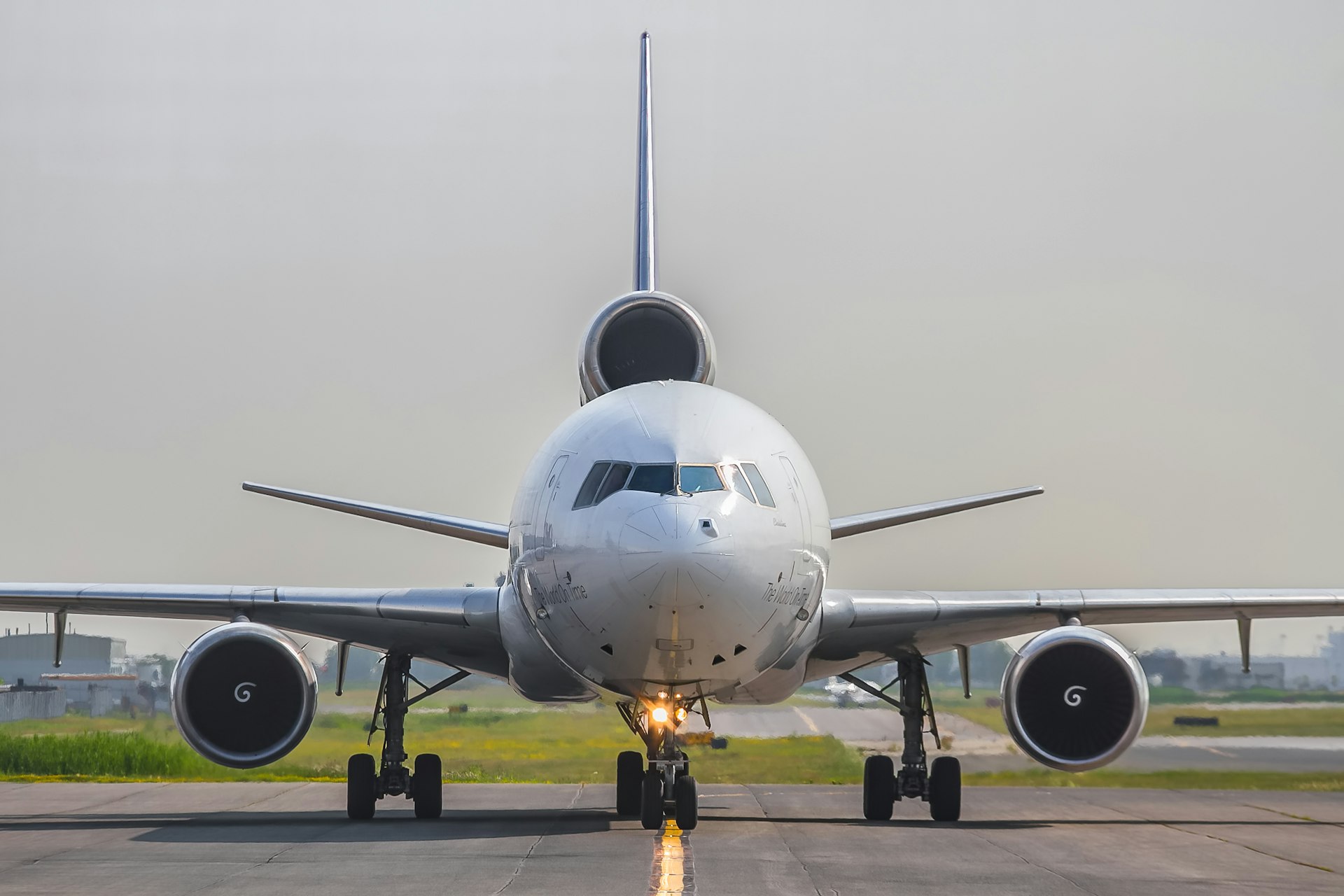 a large jetliner sitting on top of an airport runway